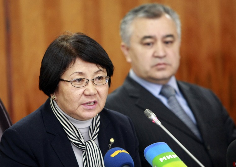 Image: Otunbayeva, the interim government leader, speaks as she sits next to Vice Premier Tekebayev during a news conference in Bishkek