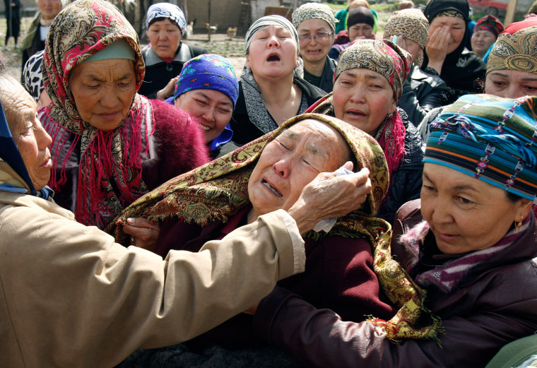 Image: People grieve during a funeral ceremony for those killed during the uprising in Bishkek