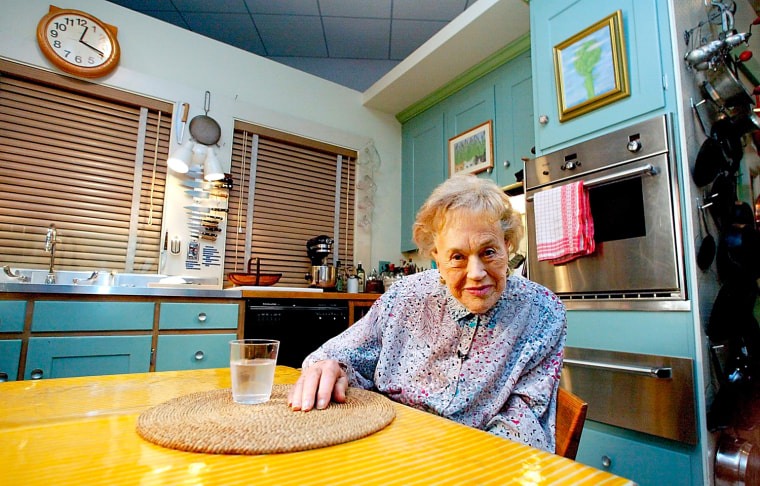 Julia Child sits in her kitchen after being moved