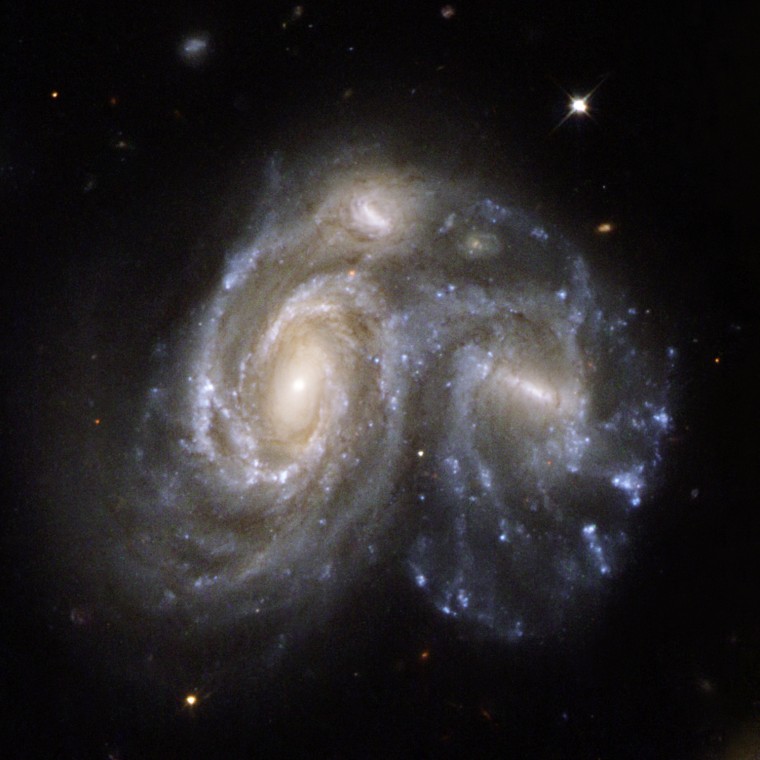 **EMBARGOED UNTIL 9:00 AM EDT THURS., APRIL 24, 2008** This image made by the Hubble Space Telescope and released by NASA Thursday, April 24, 2008 , shows a Hubble view of Arp 272, a remarkable collision between two spiral galaxies, NGC 6050 and IC 1179, and is part of the Hercules Galaxy Cluster, located in the constellation of Hercules. The galaxy cluster is part of the Great Wall of clusters and superclusters, the largest known structure in the Universe. The two spiral galaxies are linked by their swirling arms. Arp 272 is located some 450 million light-years away from EarthThis image is part of a large collection of 59 images of merging galaxies taken by the Hubble Space Telescope and released on  its 18th launch anniversary.(AP Photo/NASA, ESA)