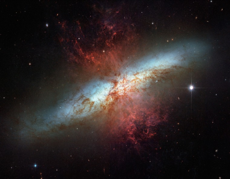 To celebrate the NASA-ESA Hubble Space Telescopes 16 years of success, NASA and the European Space Agency are releasing this mosaic image of the starburst galaxy, Messier 82 (M82),  made in March 2006. It is the sharpest wide-angle view ever obtained of M82, a galaxy remarkable for its webs of shredded clouds and flame-like plumes of glowing hydrogen blasting out from its central regions. Located 12 million light-years away, it is also called the \"Cigar Galaxy\" because of the elongated elliptical shape produced by the tilt of its starry disk relative to our line of sight. (AP Photo/NASA-ESA)