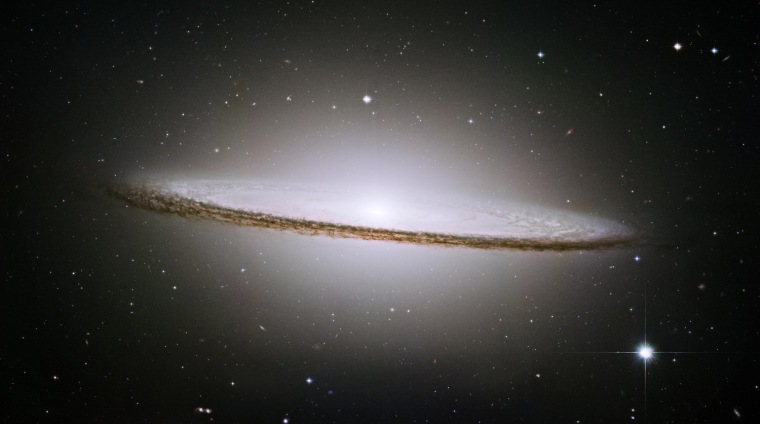 NASA's Hubble Space Telescope trained its eye on one of   the universe's most stately and photogenic galaxies, the Sombrero galaxy with the space telescope's Advanced Camera for Surveys , in  May-June 2003 .  The image of the galaxy's hallmark brilliant white, bulbous core encircled by the thick dust lanes comprising the spiral structure of the galaxy was released Wednesday, Oct. 1, 2003. As seen from Earth, the galaxy is tilted nearly edge-on. We view it from just six degrees south of its equatorial plane.This brilliant galaxy was named the Sombrero because of its resemblance  to the broad rim and high-topped Mexican hat. (AP Photo/NASA ,The Hubble Heritage Team)