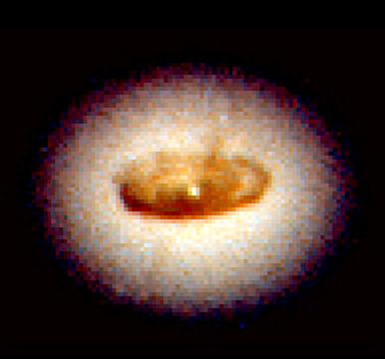Feeding a black hole
A spiral-shaped disk of dust fuels what scientists believe is a black hole near the center of the galaxy NGC 4261. The material heats up and glows as it swirls around the black hole.