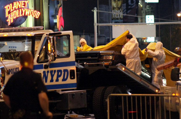 Image: Nissan SUV towed out of Times Square