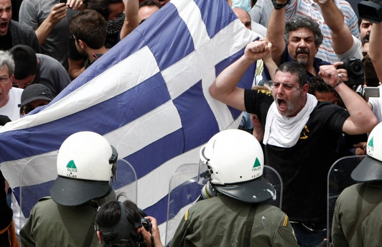 Image: Demonstartors and riot police face off during nationwide strike over austerity measures in Athens