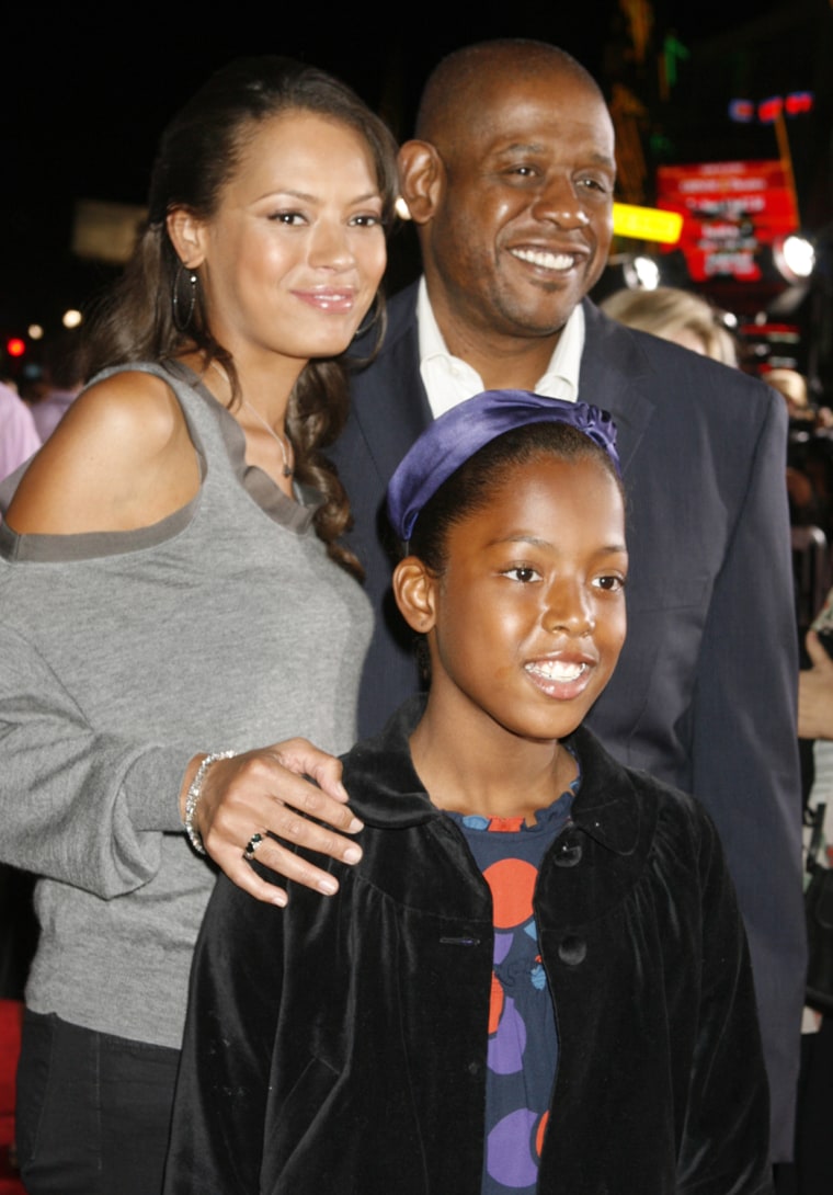 Image: Actor Forest Whitaker and family pose at the premiere of the new film \"Old Dogs\" in Hollywood