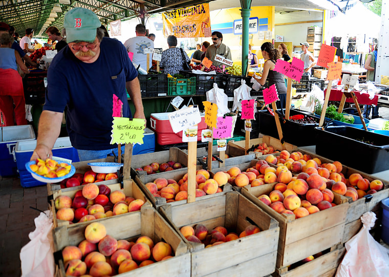 Image: A vendor puts out fruit samples on Augus