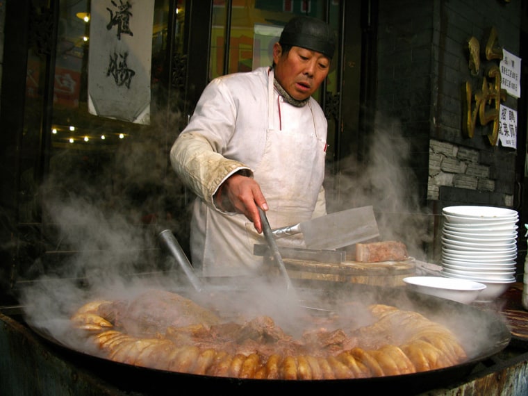 Image: A cook prepares traditional old Beijing