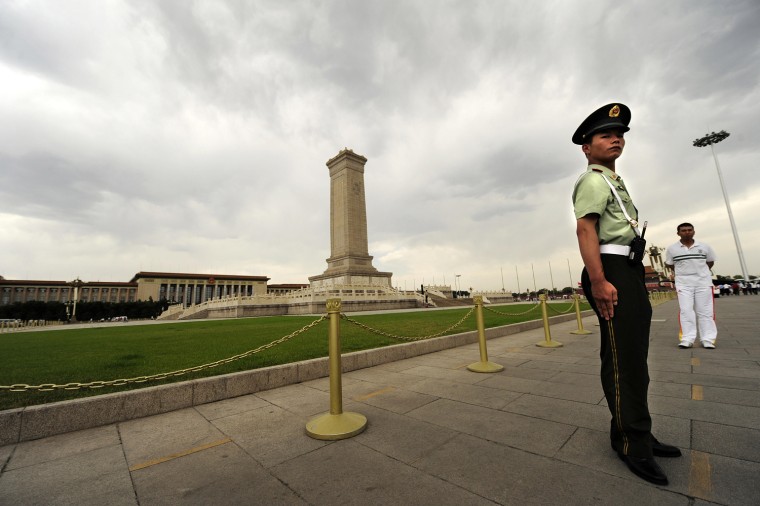 Image: A Chinese paramilitary policeman stands