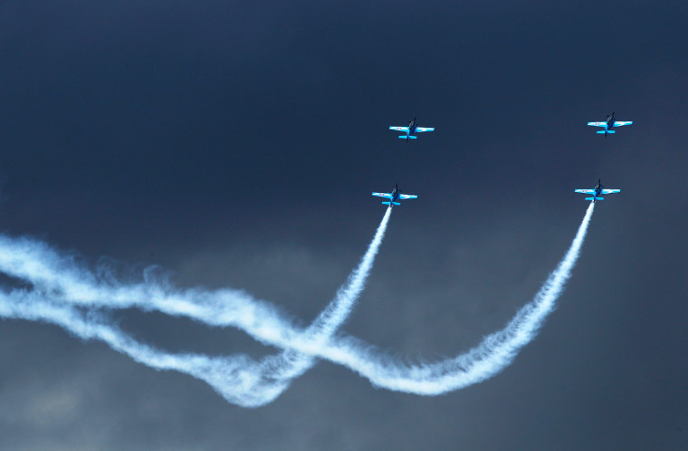 Image: Aerobatic team The Blades perform at the Farnborough Airshow in southern England