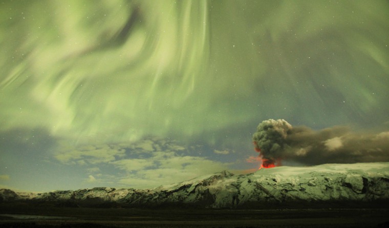 Image: The Northern Lights are seen above the ash plume of Iceland's Eyjafjallajokull volcano in the evening