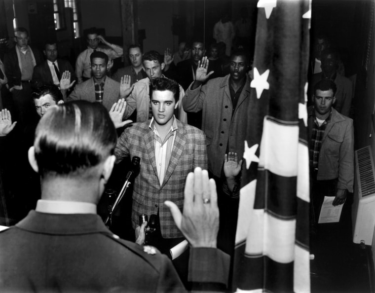 The raised right hand of Elvis Presley means the rock and roll singing idol is officially in the Army. Administering the oath at the Memphis induction center is Maj. Elbert P. Turner. By midnight March 24, 1958, Elvis and 20 other inductees from Memphis were lining up for their first formation at Fort Chaffee, Arkansas. ( By Barney Sellers / The Commercial Appeal)