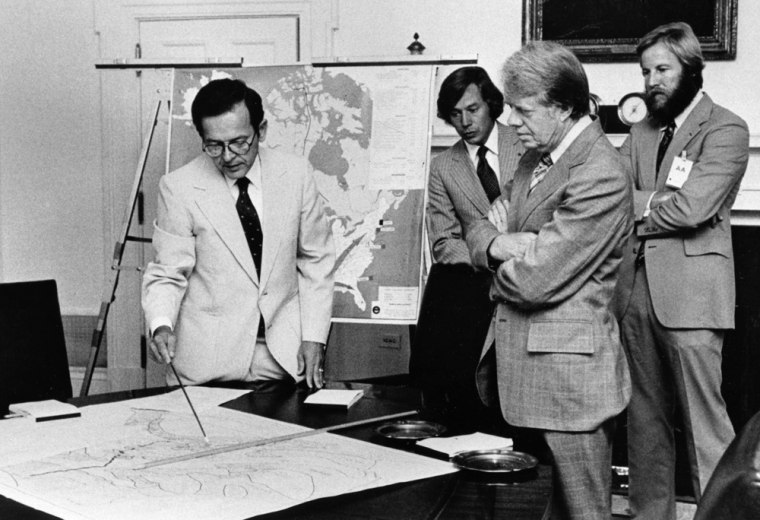 Image: Sen. Ted Stevens, R-Alaska, left, and President Jimmy Carter discuss the Alaska National Interest Lands Conservation Act.