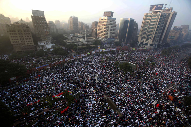 Image: Thousands of Egyptian Muslims pray during the first day of Eid al-Fitr at Mostafa Mahmoud Mosque in Cairo