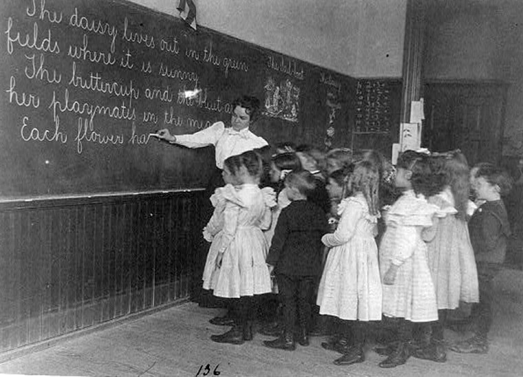 Elementary school children standing and watching teacher write at blackboard, Washington, D.C.
Johnston, Frances Benjamin, 1864-1952, photographer