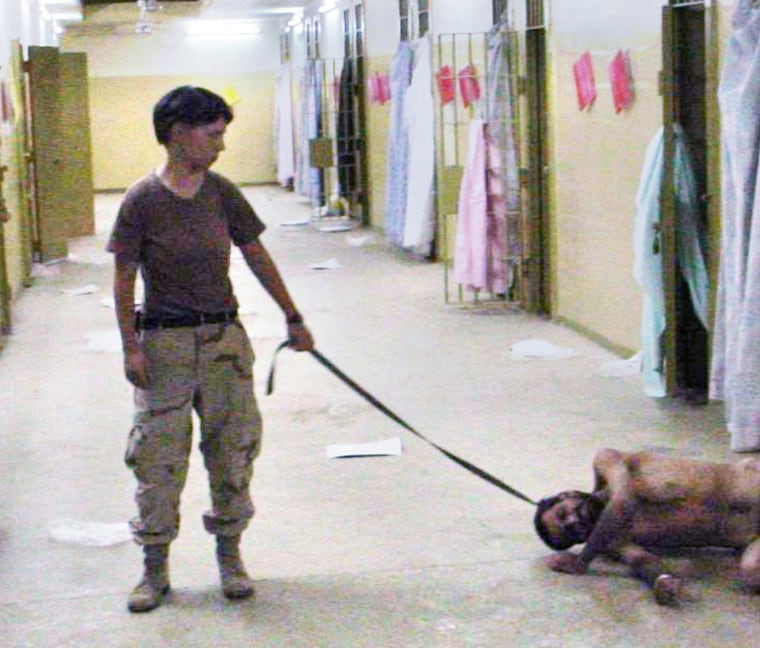 NA/PHOTOS    Photo source:  undisclosed   Location:  Outskirts of Baghdad, Iraq     Caption:  A naked detainee at the Abu Ghraib prison is tethered by a leash to prison guard Army Pvt Lynndie England in these undated photos.  Relatives positively identified England from this photo.  These photos were cropped from the waist down for publication purposes.  **MANDATORY PHOTO CREDIT TO THE WASHINGTON POST**INTERNET OUT***   .