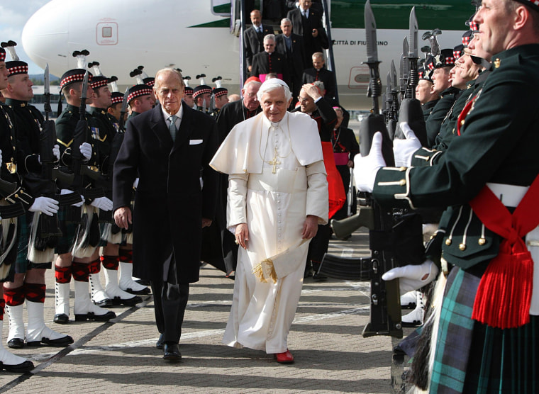 Image: Pope Benedict XVI, centre right, is met by the Duke of Edinburgh