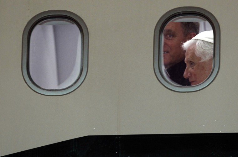 Image: Pope Benedict XVI is seen next to his personal secretary, father Gaenswein George, as they arrive at the Ciampino airport in Rome