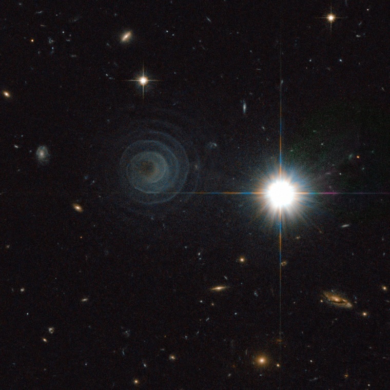The Hubble Space Telescope spots an unusual spiral nebula around the star LL Pegasi. Astronomers say the spiral shape was created by material swirling out from one of the stars in a binary-star system.