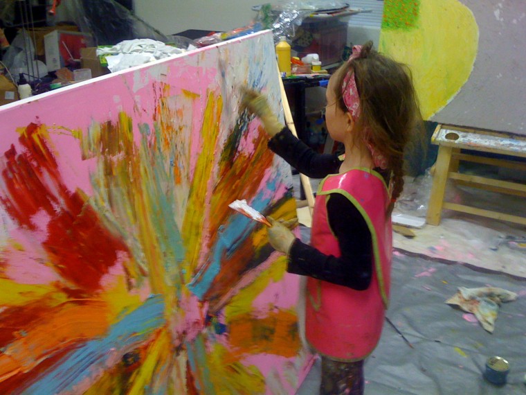 Autumn de Forest painting one of her artworks at home in her studio in Las Vegas, Nevada.