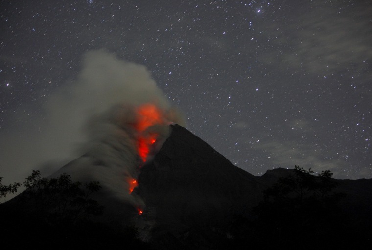 Image: Mount Merapi volcano spews smoke as seen from Sidorejo village in Klaten
