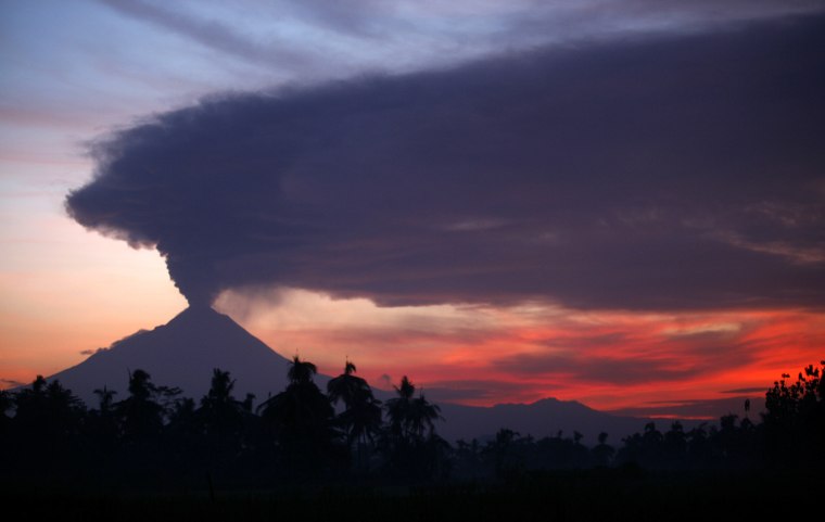 Image: Mount Merapi volcano erupts, as seen from Mungkid village in Magelang in Indonesia's central Java province