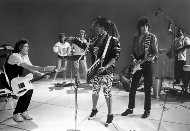 Aretha Franklin w/Keith Richards and Ron Wood (of the Rolling Stones) performing \"Jumpin' Jack Flash\" for that movie's soundtrack, 1986
