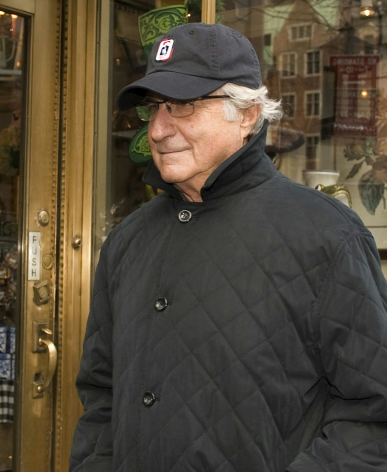 Image: (FILES) Bernard L Madoff walks down Lexi