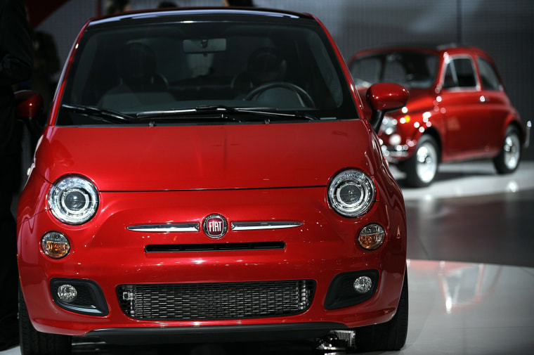 Image: The new Fiat 500 is seen next to the old