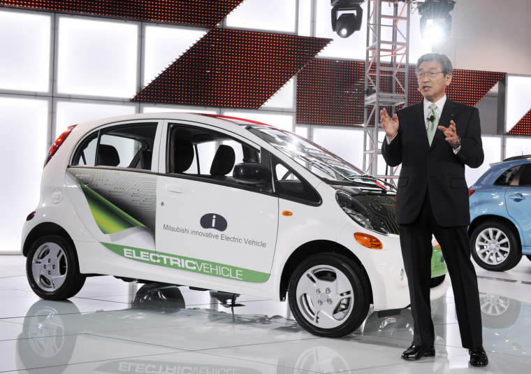 Image: Shinichi Kurihara, President and CEO of Mitsubishi Motors North America, introduces the Mitsubishi i electric vehicle at the LA Auto show in Los Angeles