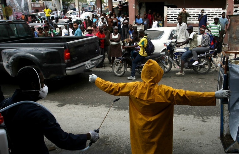 Image: A health worker is disinfected on Novemb