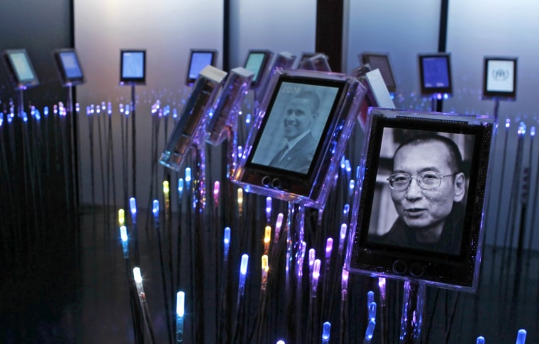 Image: A picture of this year's Nobel Peace Laureate Liu Xiaobo is seen at an exhibition at the Nobel Peace Center in Oslo