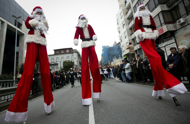 Image: People dressed as Santa Claus participat