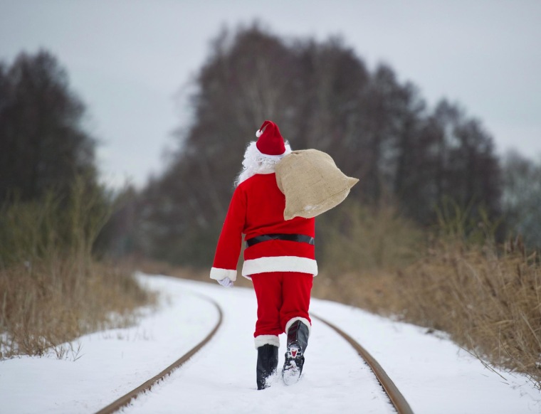 Image: Santa walks through the snowy winter landscape