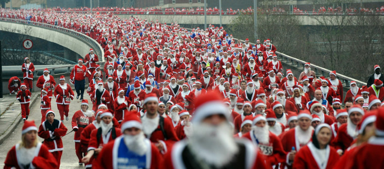 Image: Runners dress as Santa Claus take part i
