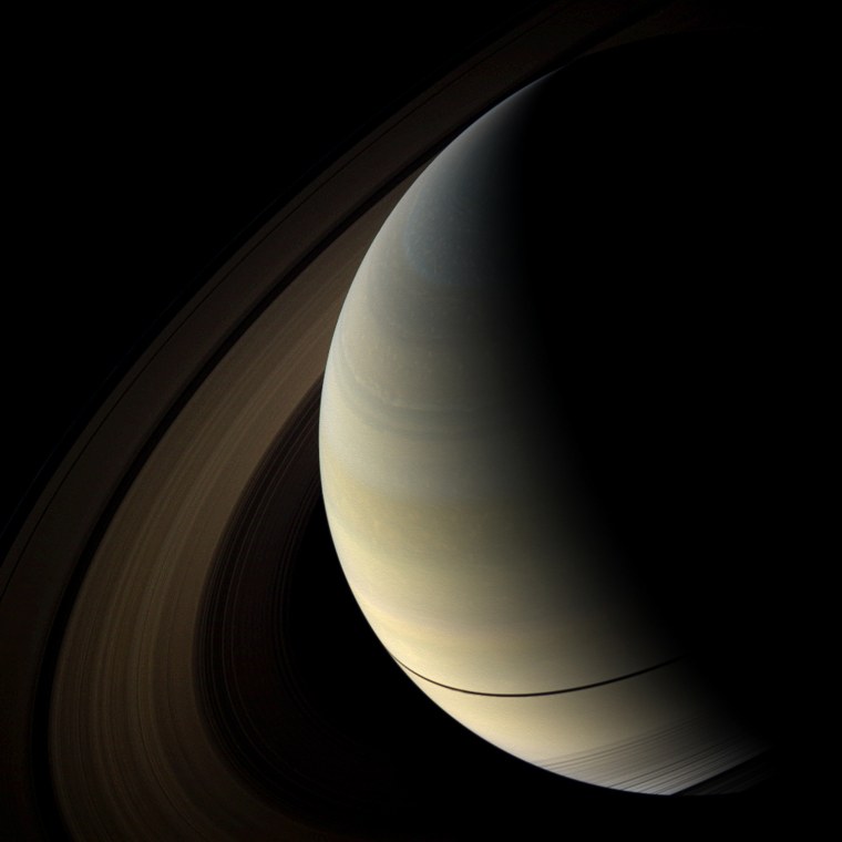 The shadows of Saturn's rings cast onto the planet appear as a thin band at the equator in this image taken as the planet approached its August 2009 equinox.

The novel illumination geometry that accompanies equinox lowers the sun's angle to the ringplane, significantly darkens the rings, and causes out-of-plane structures to look anomalously bright and to cast shadows across the rings. These scenes are possible only during the few months before and after Saturn's equinox which occurs only once in about 15 Earth years. Before and after equinox, Cassini's cameras have spotted not only the predictable shadows of some of Saturn's moons (see PIA11657), but also the shadows of newly revealed vertical structures in the rings themselves (see PIA11665). For an earlier view of the rings' wide shadows draped high on the northern hemisphere, see PIA09793.

The planet's southern hemisphere can be seen through the transparent D ring in the lower right of the image. The rings have been brightened by a factor of 9.5