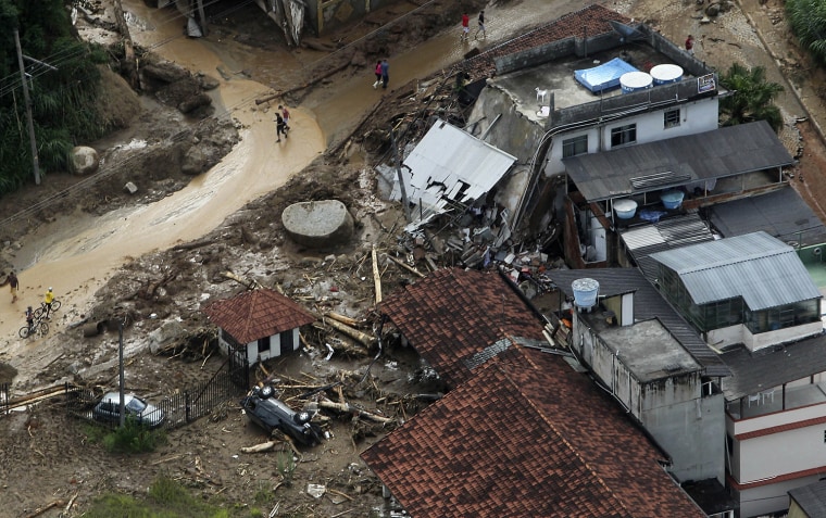Image: An aerial view shows damage caused to a street after heavy rains in Nova Frigurgo City, Brazil