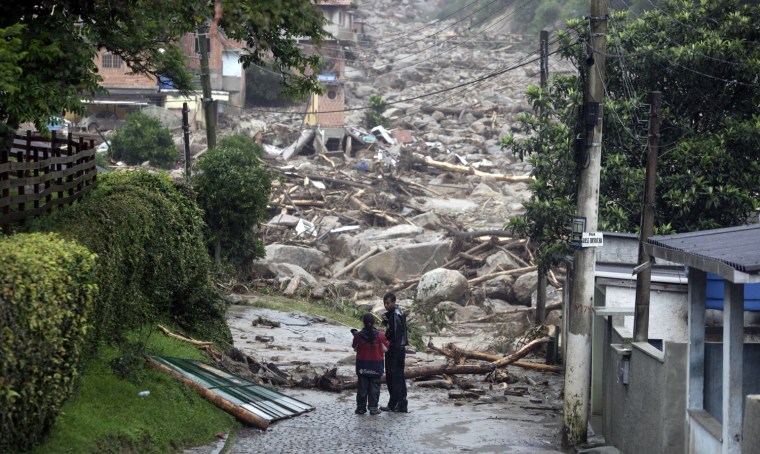 Image: Residents talk after a landslide in Teresopolis