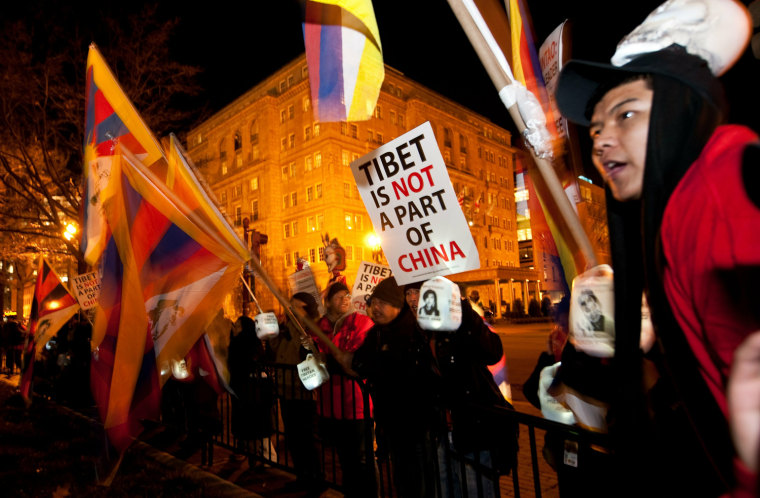 Image: Tibetan protesters chant slogans during