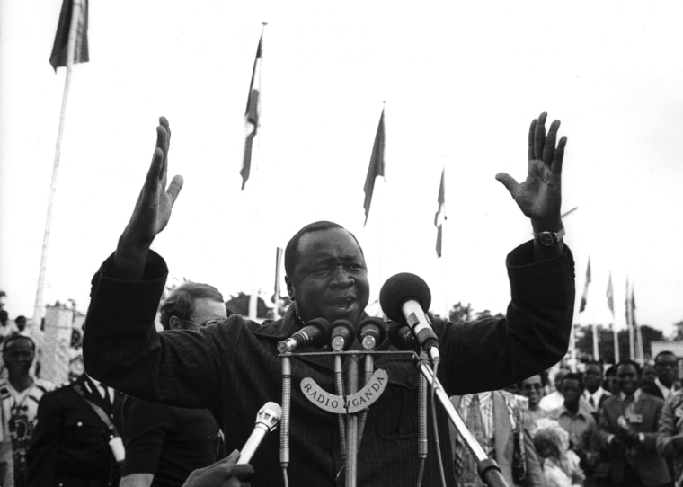President of Uganda Idi Amin Dada (C) gestures whi