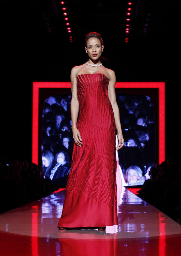 Image: Dania Ramirez presents a creation during the Heart Truth's Red Dress Collection 2011 Fashion Show at New York Fashion Week