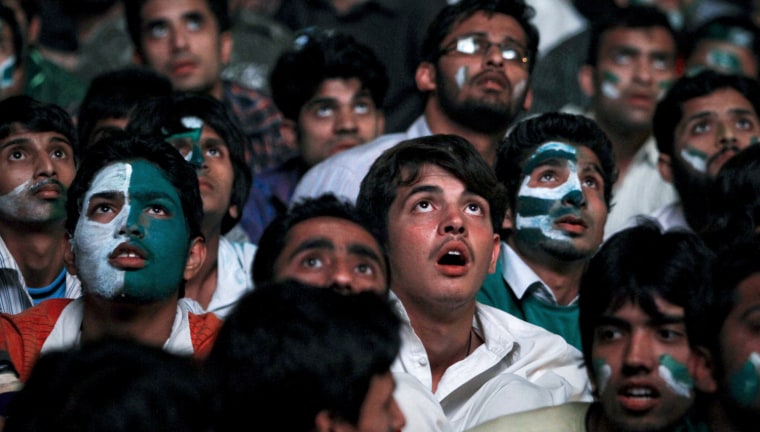 Image: Pakistanis react while watching on a large screen their national team play India during a ICC Cricket World Cup semi-final match, in Islamabad