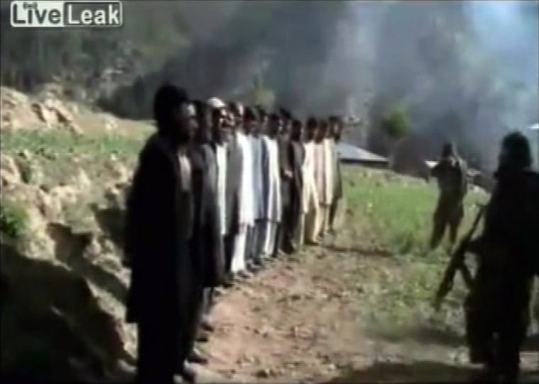Image: Video grab of Taliban lining up Pakistani security personnel before shooting at them in a firing squad style