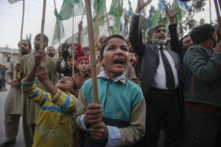 Image: Young supporters of Jamaat-e-Islami yell anti-American slogans while protesting in Islamabad