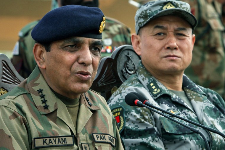 Image: Pakistani Army Chief General Kayani speaks beside Chinese General Hou, the deputy chief of general staff of the PLA, during a news conference after joint military exercises in Jhelum