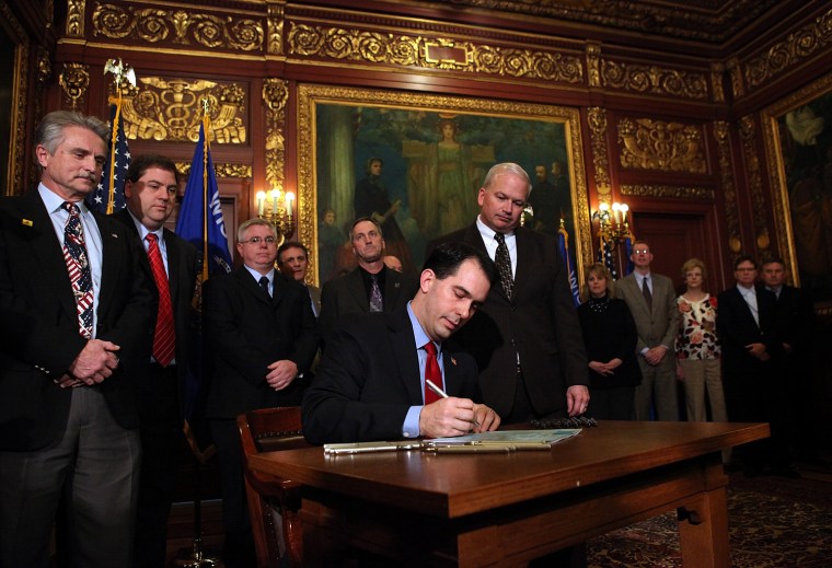 Wisconsin Governor Scott Walker performs ceremonial bill signing