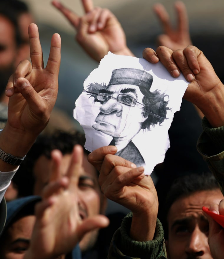 Image: Libyan protesters flash the V for \"victo