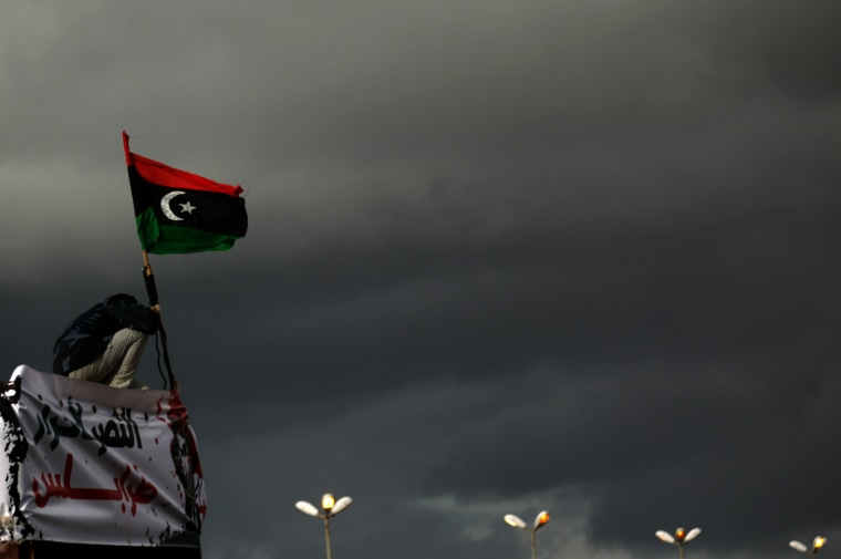 Image: A Libyan anti-goverenment protester rais