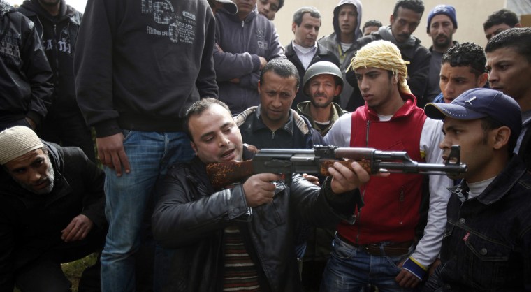Image: Anti-government rebels undergo weapon training in a military base in Benghazi