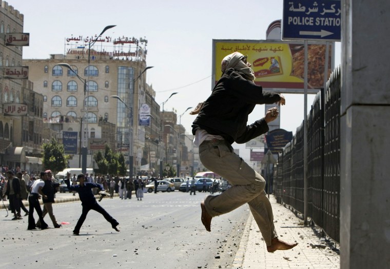 Image: A Yemeni anti-government protester jumps